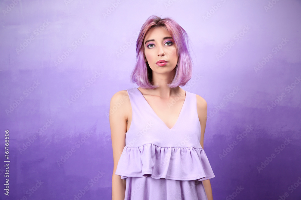 Beautiful young woman in dress on lilac background Beautiful young woman in dress on lilac background