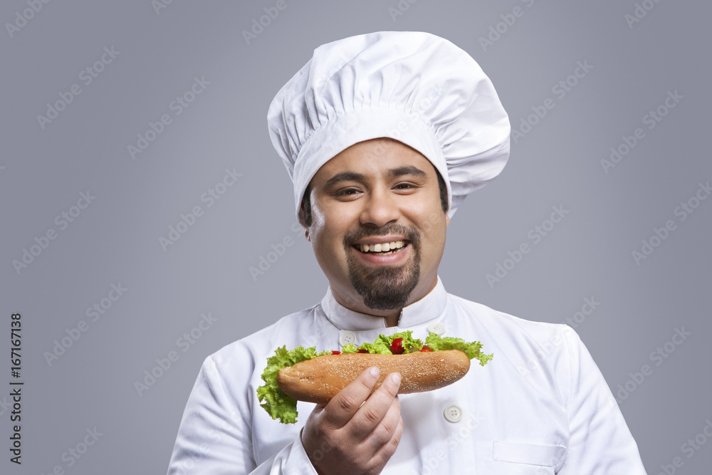 Portrait of chef with sandwich smiling Portrait of chef with sandwich smiling