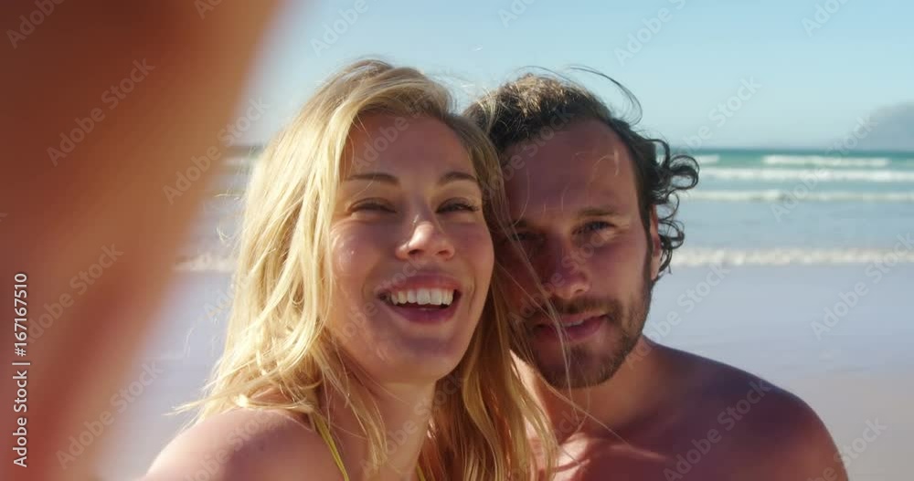 Couple standing together at beach Couple standing together at beach