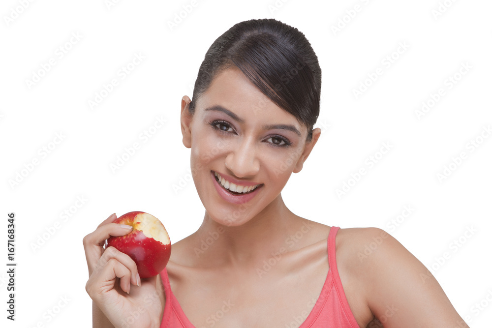 Portrait of pretty woman with bitten apple over white background Portrait of pretty woman with bitten apple over white background