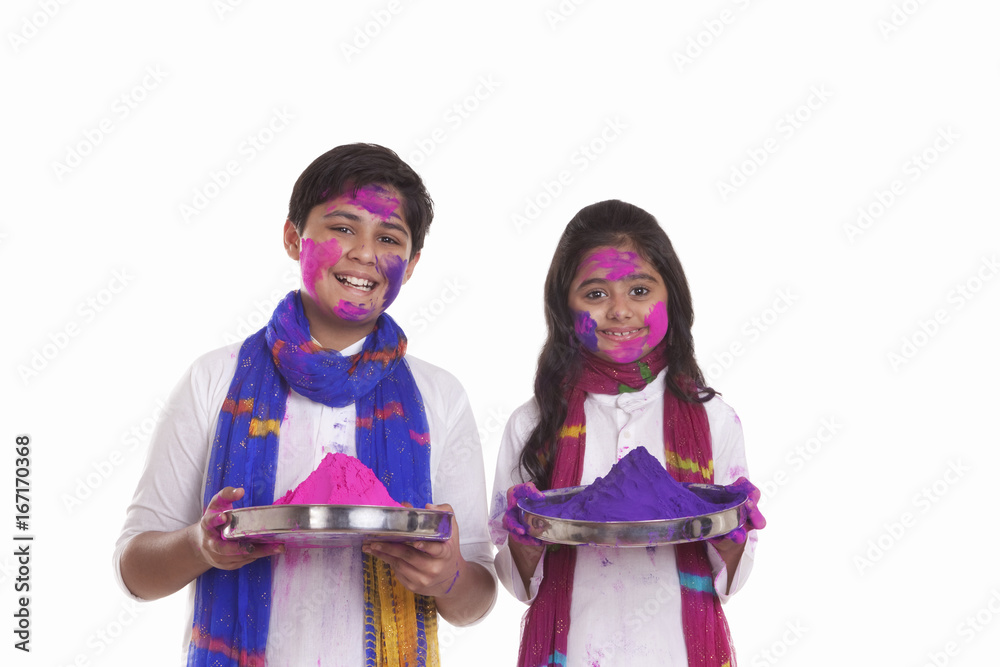 Portrait of a boy and girl with holi colour