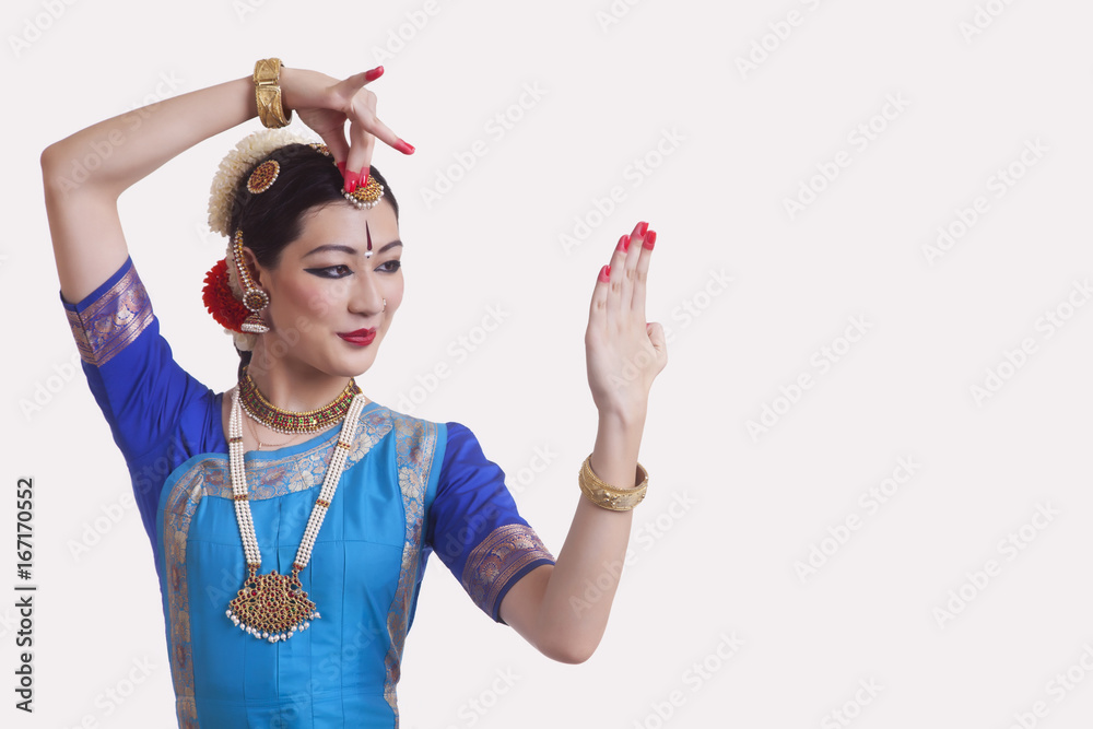 Woman performing Bharatanatyam the classical dance of India on white  background Stock Photo | Adobe Stock