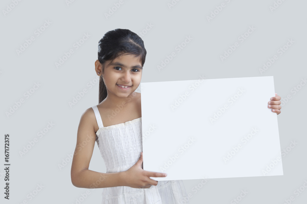 Portrait of little girl holding a white board Portrait of little girl holding a white board