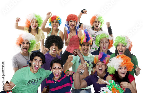Portrait of youngsters with wigs cheering 