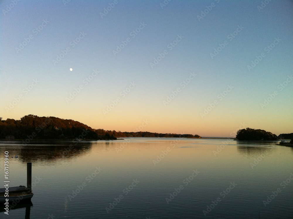 tranquil sunset scene with trees and water tranquil sunset scene with trees and water