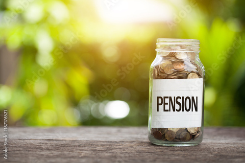 pension Word With Coin In Glass Jar.
