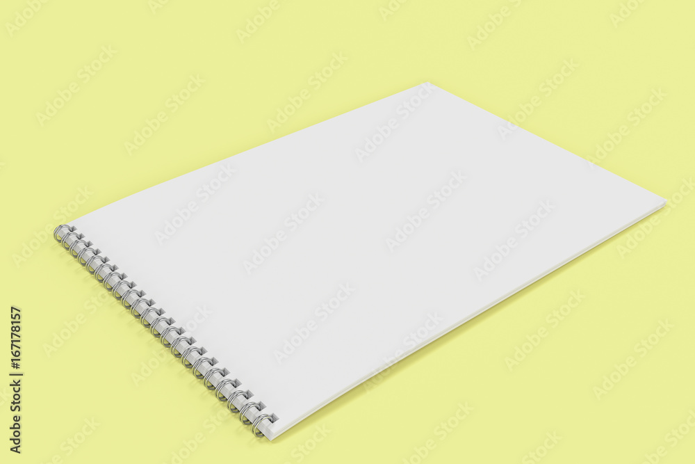 Blank white notebook with metal spiral bound on yellow background Blank white notebook with metal spiral bound on yellow background