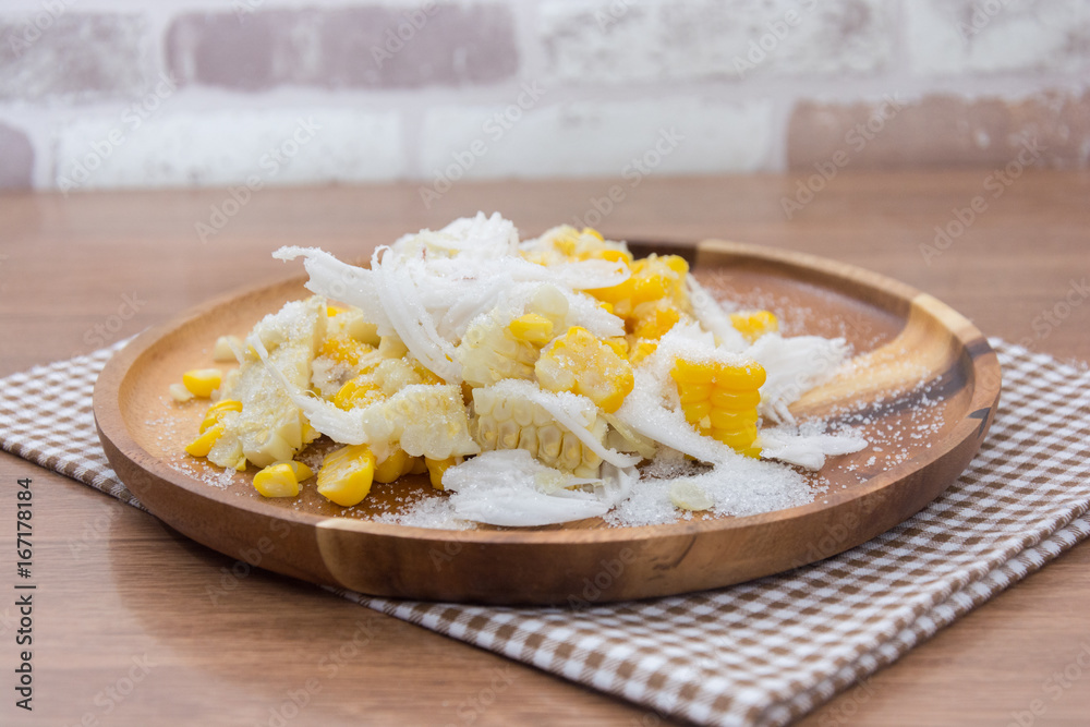 Sweet Corn with coconut and sugar on wooden plate Sweet Corn with coconut and sugar on wooden plate