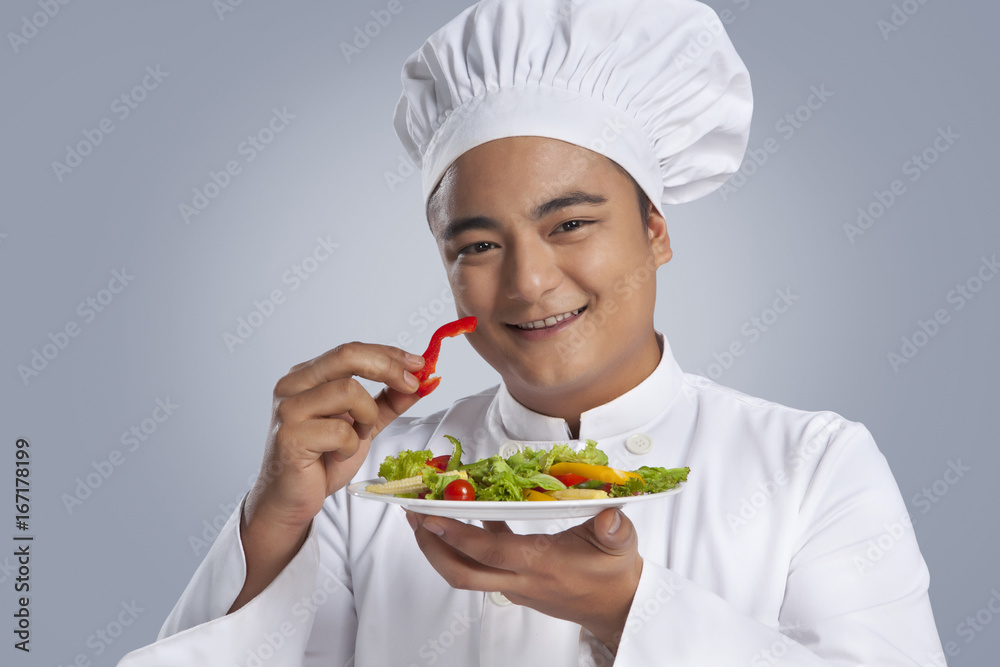 Portrait of chef with plate of vegetables Portrait of chef with plate of vegetables