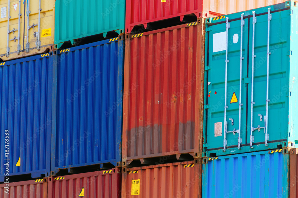 Fototapeta premium Several colorful containers stacked in a port