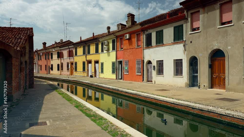 architectural wonder of Italy, colorful houses of the lagoon town of Comacchio, known as The Little Venice, near Ferrara, in Italy, color graded clip architectural wonder of Italy, colorful houses of the lagoon town of Comacchio, known as The Little Venice, near Ferrara, in Italy, color graded clip