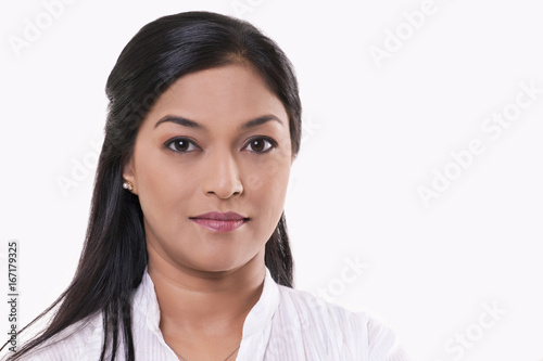 Portrait of mid adult woman over white background 