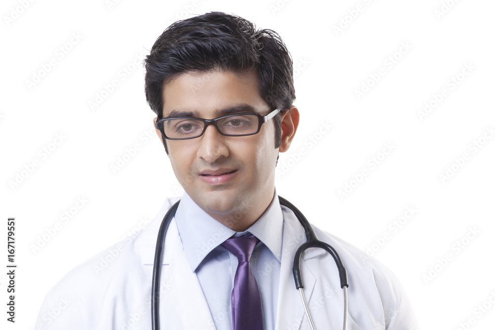 Handsome male doctor smiling over white background Handsome male doctor smiling over white background
