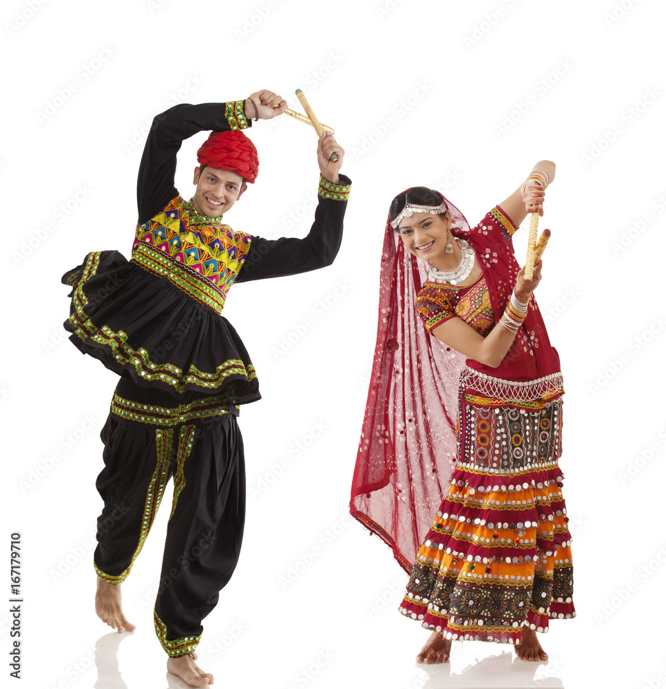 Couple performing dandia dance 