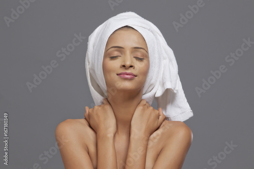 Woman smiling with a towel on head 