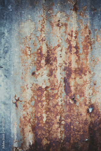 Old rusty corrugated tin zinc metal wall in vintage tone