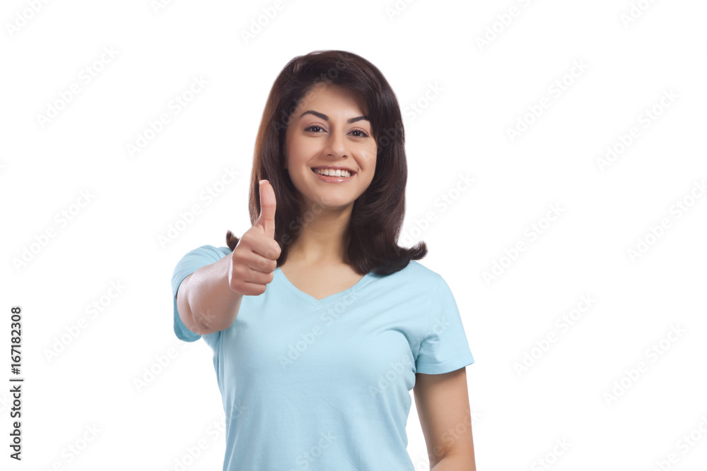 Portrait of a woman giving thumbs up Portrait of a woman giving thumbs up