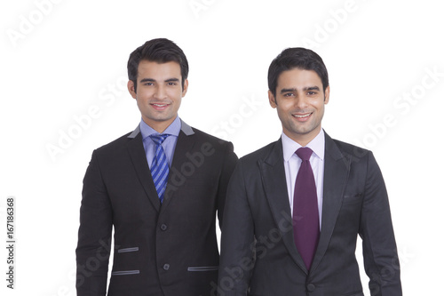 Portrait of two businessmen smiling