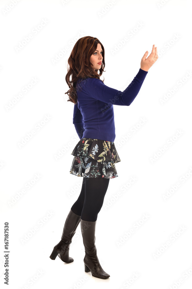 full length portrait of brunette woman wearing modern casual clothes. standing pose, isolated on white background full length portrait of brunette woman wearing modern casual clothes. standing pose, isolated on white background