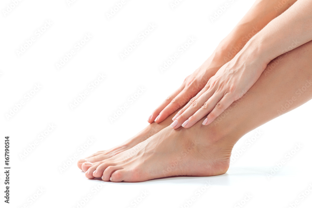 Beautiful women feet isolated on white close-up Beautiful women feet isolated on white close-up