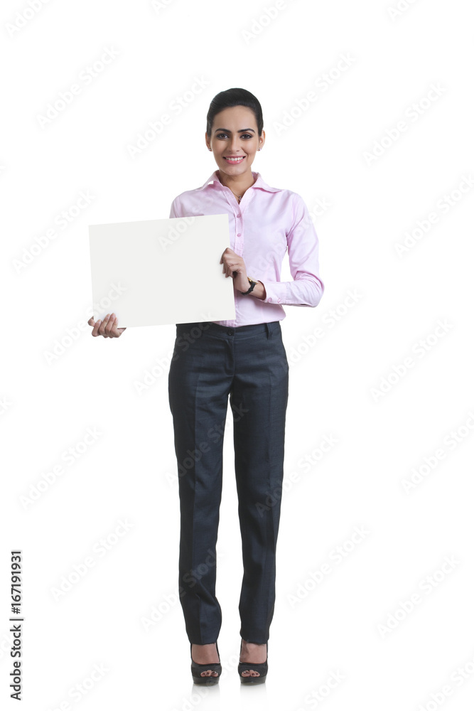 Full length portrait of happy young businesswoman showing blank board over white background Full length portrait of happy young businesswoman showing blank board over white background
