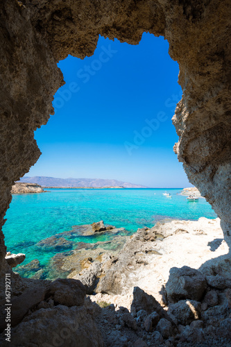 Amazing view of Koufonisi island with magical turquoise waters, lagoons, tropical beaches of pure white sand and ancient ruins on Crete, Greece © gatsi