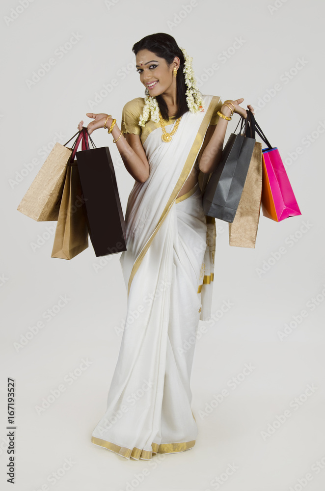 Portrait of South Indian woman with shopping bags