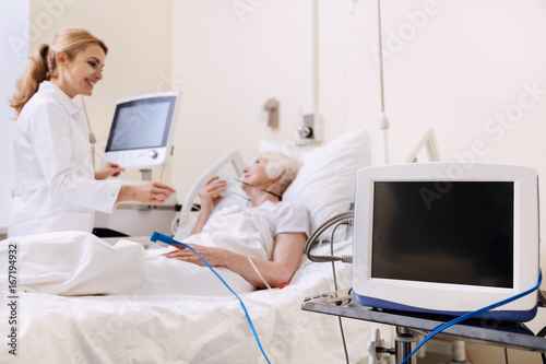 Friendly bright woman enjoying conversation with her doctor