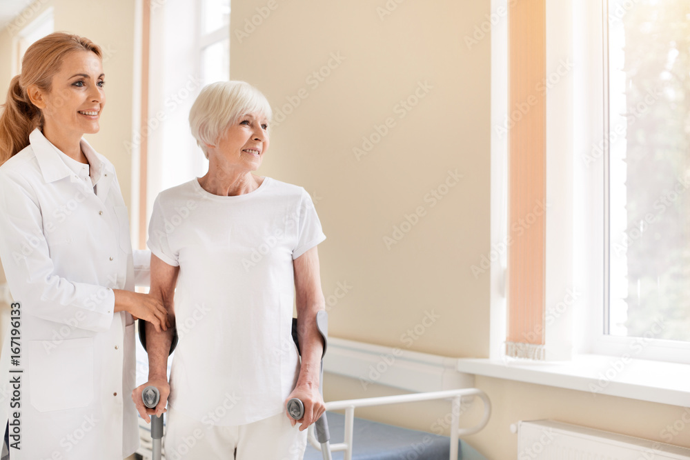 Admirable motivated lady learning walking again
