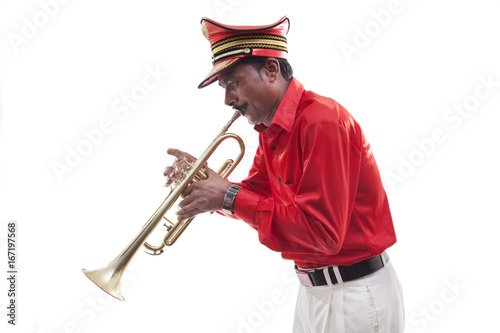 Bandwala playing on a trumpet