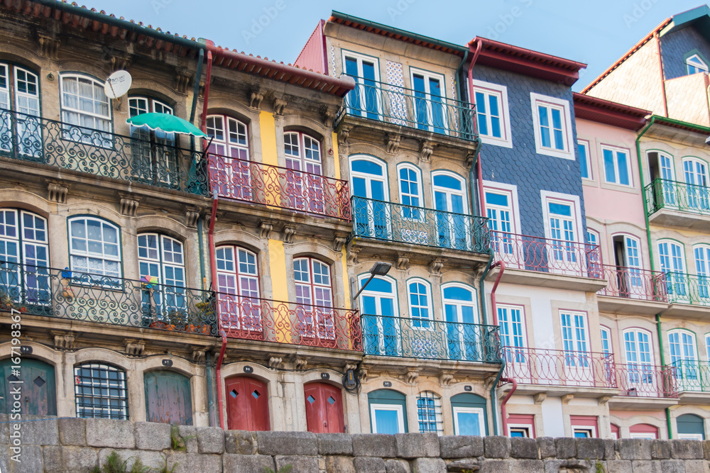     Porto in Portugal, typical houses on the river Douro, colored buildings 
