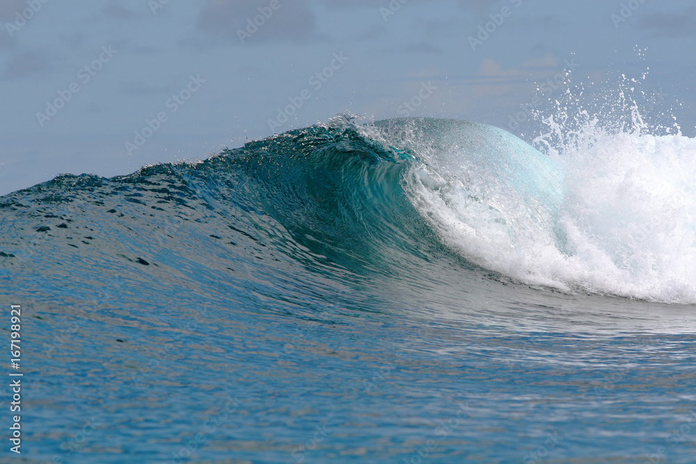 rough white blue ocean wave falling down