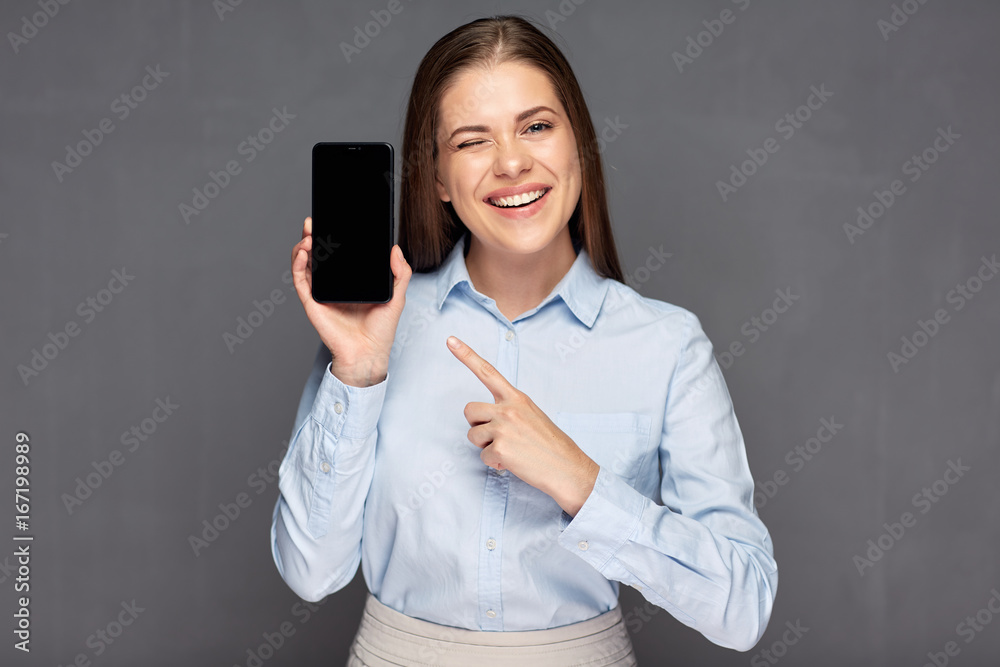 woman presenting smart phone with empty screen and pointing finger. woman presenting smart phone with empty screen and pointing finger.
