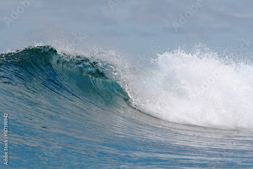rough white blue ocean wave falling down