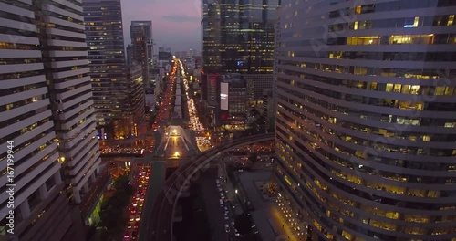 Office Blocks and Busy Streets in Sathorn District, Bangkok, Thailand, Aerial Drone Shot

