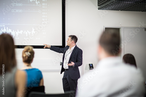 Businessman leading a training conference photo