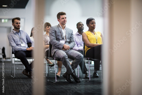 Audience listening at a business conference photo