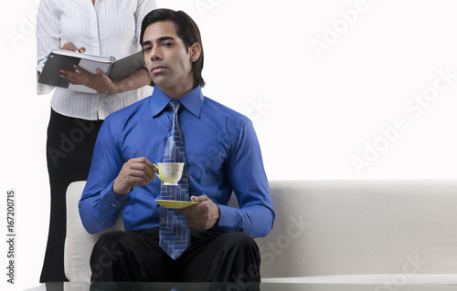Businessman holding a cup of coffee 