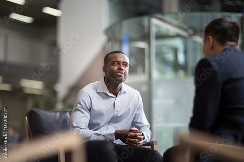Businessman being asked a question in an interview