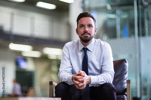 Businessman looking out of window 