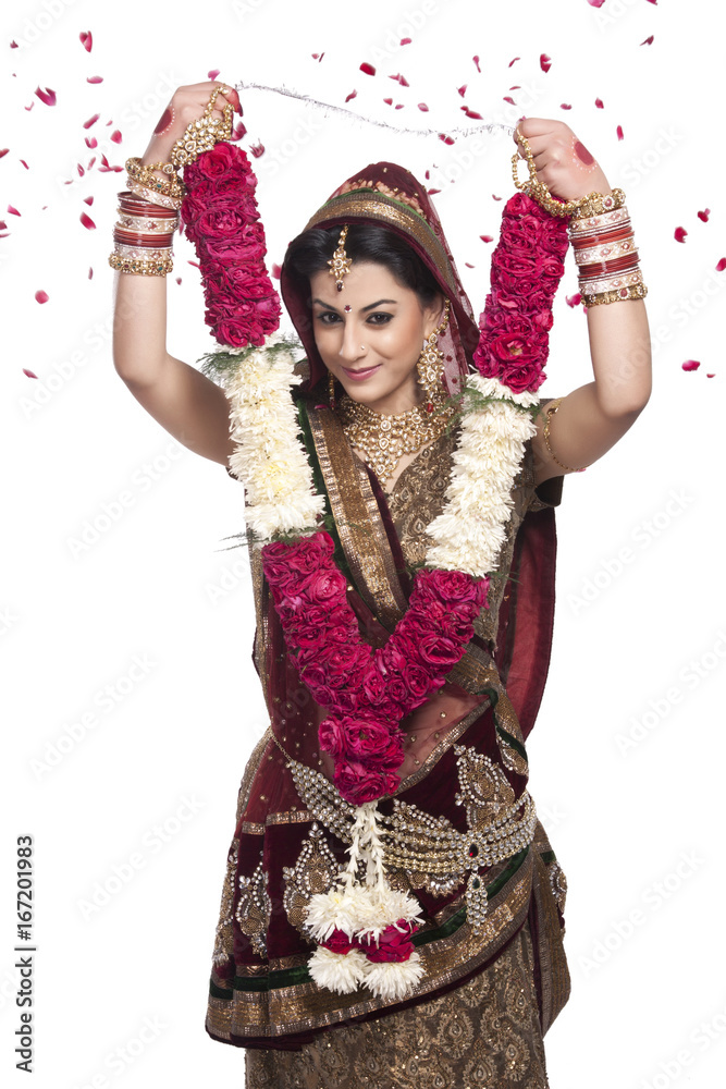 Beautiful bride holding a garland Beautiful bride holding a garland