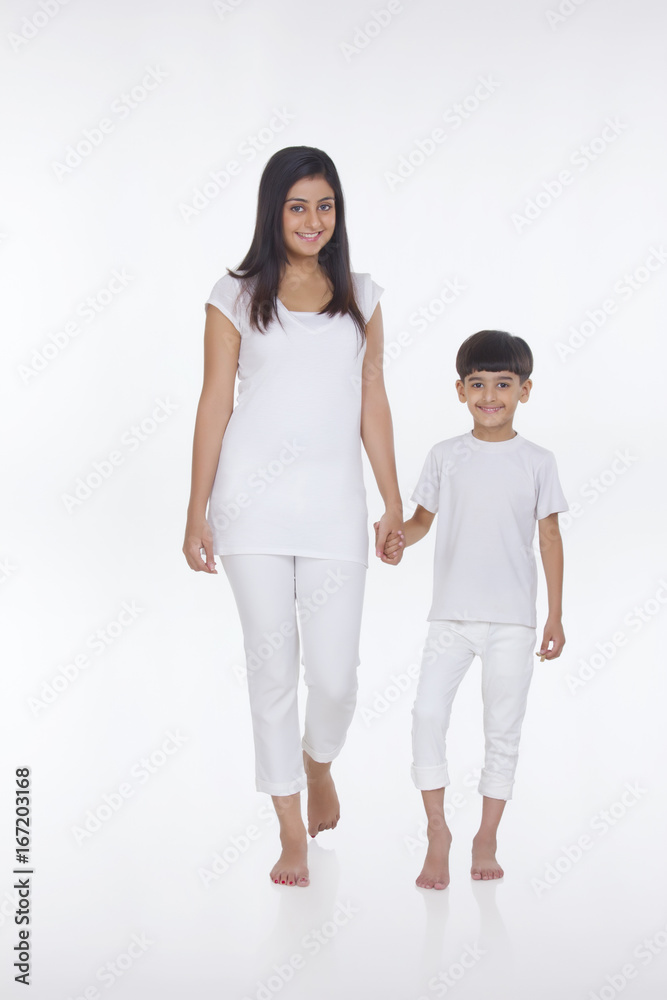 Portrait of mother and son holding hands Portrait of mother and son holding hands