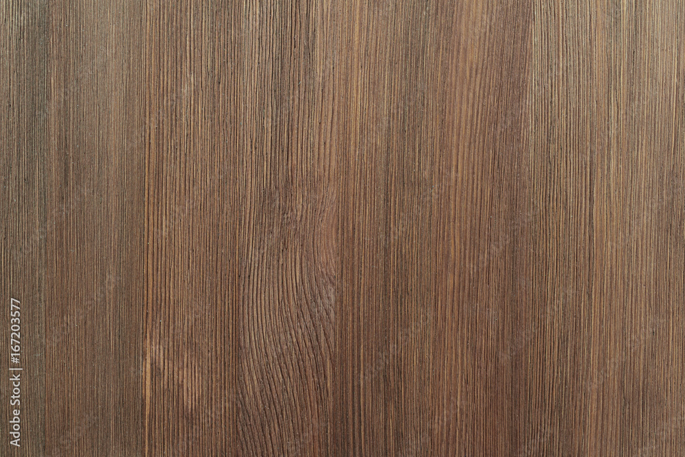 Natural color wooden board surface. Textured background from woodnut planks. Vertical grain. Natural color wooden board surface. Textured background from woodnut planks. Vertical grain.