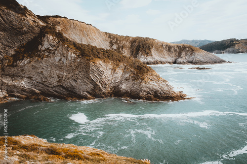 Water flowing calmly in mountain valley photo