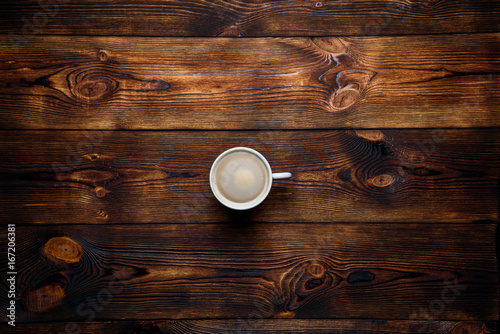 Coffee on a brown wooden background