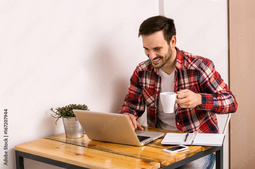 Entrepreneur working with a laptop in home office