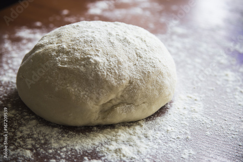 Preparation for baking bread - kneading dough in your home kitchen