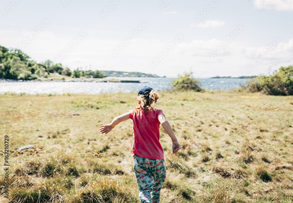 Girl running in meadow Girl running in meadow