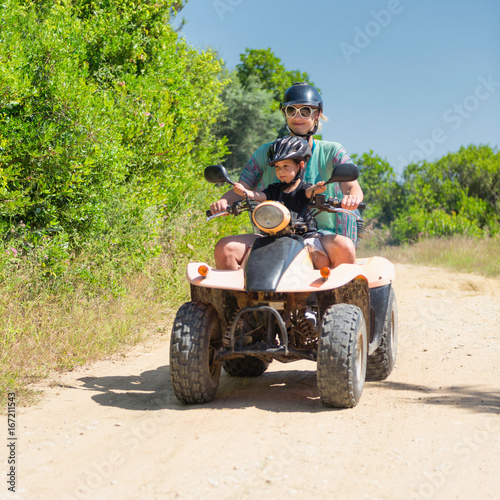 Woman and child on ATV