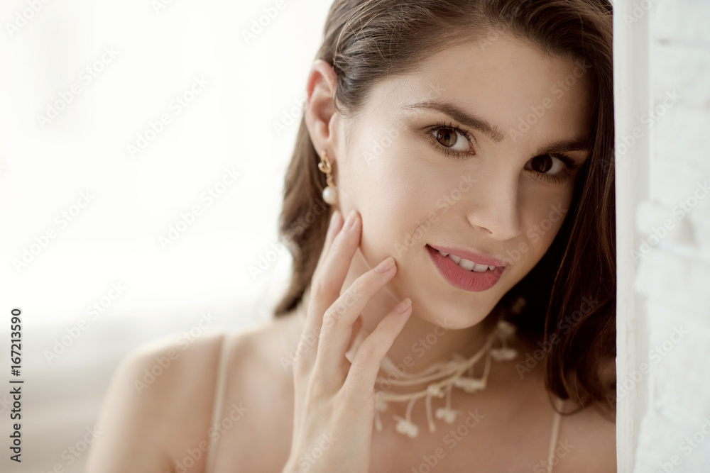 Closeup brunette bride with fashion wedding hairstyle and makeup Closeup brunette bride with fashion wedding hairstyle and makeup